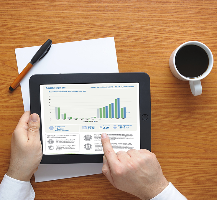 businessman analyzing bill on tablet